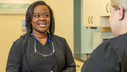 Two dental tema members talking