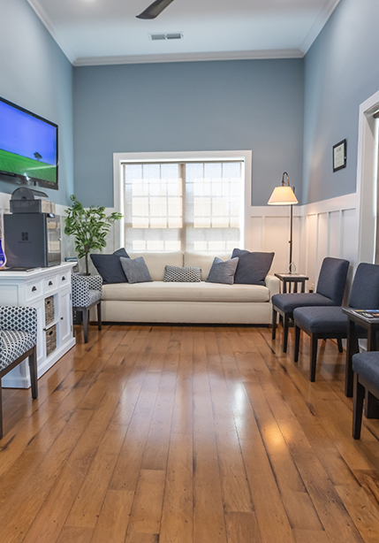Waiting room at Magnolia Shores Dental with pristine hardwood floors