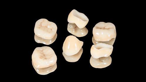 Several tooth colored dental crowns