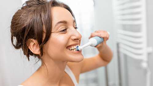 Woman brushing her teeth