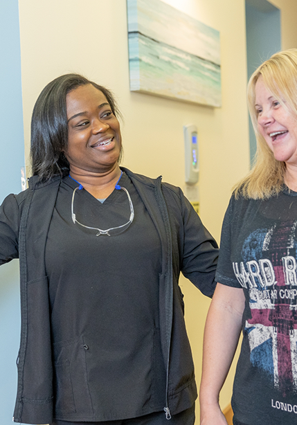 Woman arriving for treatment at an emergency dentist's office in Summerfield