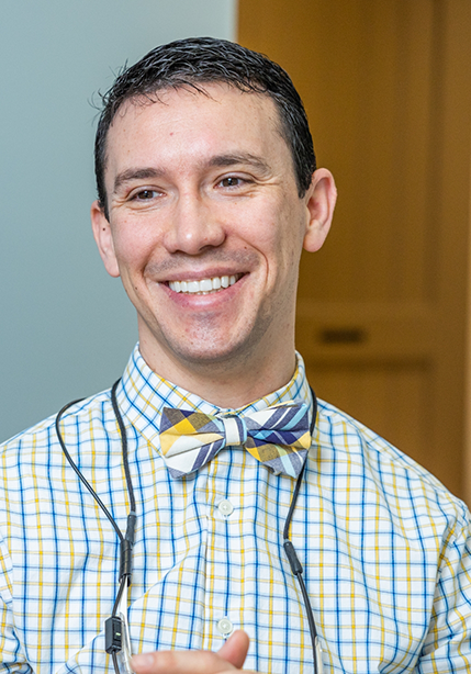 Doctor Parry smiling at a dental patient