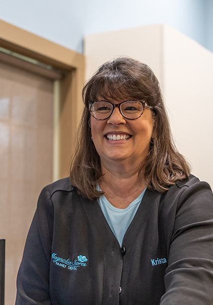 Summerfield dental team member smiling at a patient
