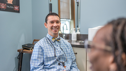 Doctor Parry smiling at a dental patient