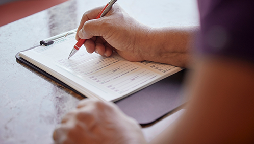 Person filling out paperwork