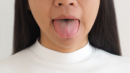 Woman sticking out her tongue