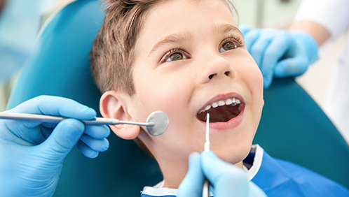 Young boy receiving a dental exam