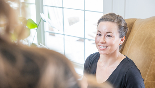 Dental team member smiling at a patient