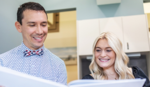 Doctor Parry showing a book to a patient
