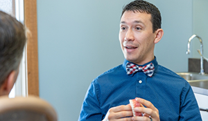 Doctor Parry talking to a dental patient