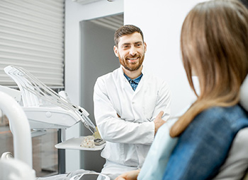 dentist explaining dental implant treatment to patient