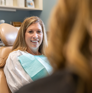 man smiling while visiting dentist 