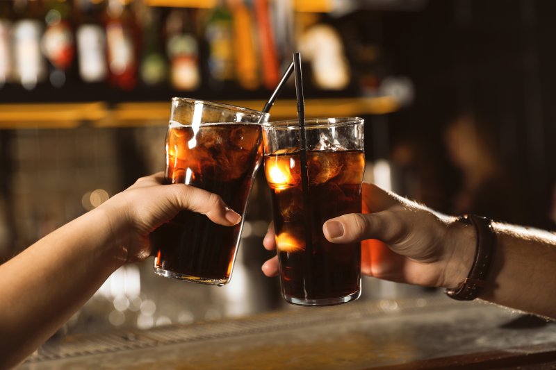 Patients with good dental health drinking soda together 